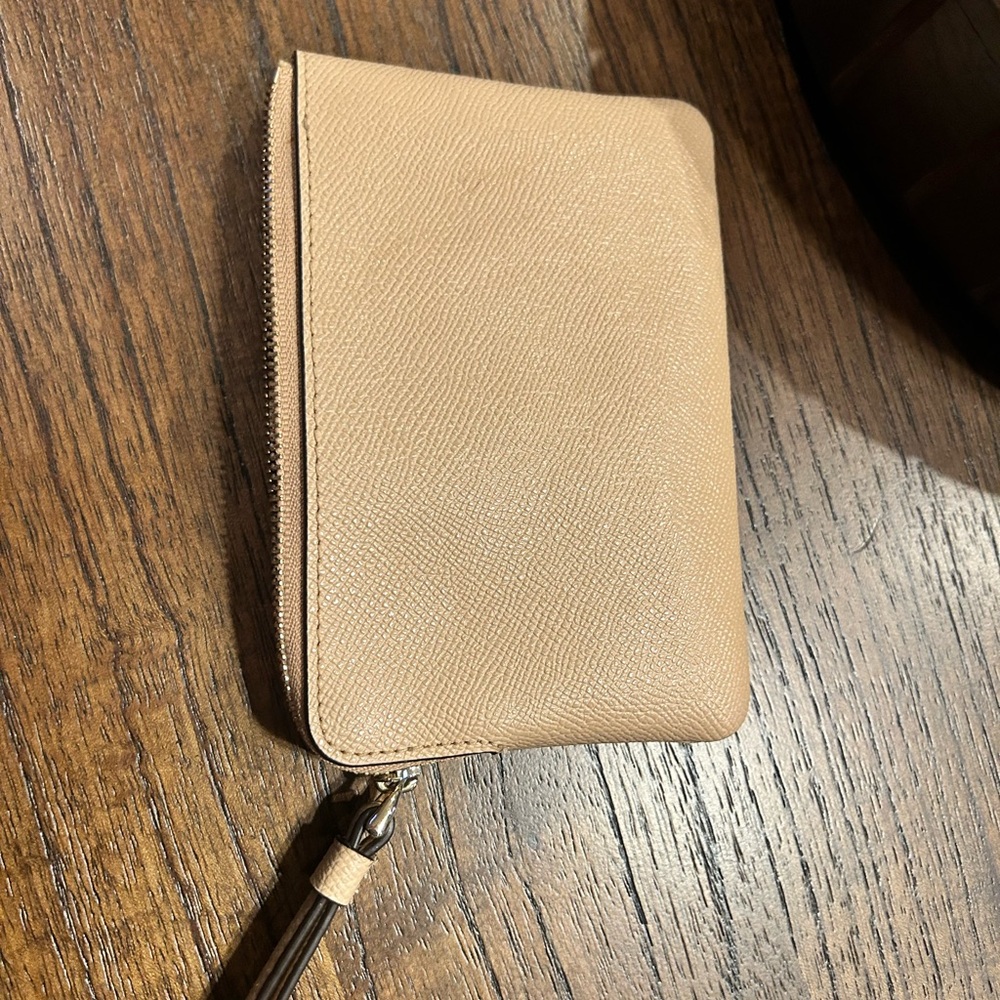 Coach Corner Zip Wristlet in taupe pebbled leather.